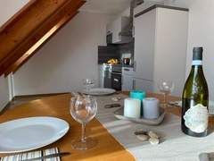 Ferienwohnung - Ferienwohnung Einladende Obergschosswohnung mit sonnigem Balkon