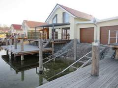 Ferienhaus - Ferienhaus Seehaus Arielle mit Wassergrundstück