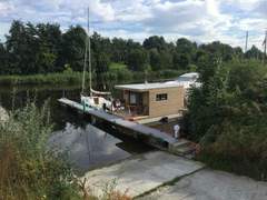 Ferienwohnung - Ferienwohnung Hausboot für zwei Personen mit Kamin und Terrasse