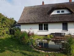 Ferienwohnung - Ferienwohnung Traumhafte Ferienwohnung im Reetferienhaus