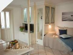 Ferienwohnung - Ferienwohnung Gemütliche Wohnung für 2 Personen mit Gartensaun
