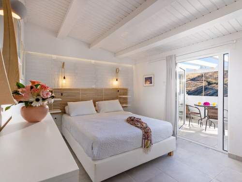 Ferienwohnung mit Doppelbett und einer Dachterrasse